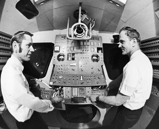 Russell A. Larson, left, Massachusetts Institute of Technology project manager for the lunar module flight program, and David G. Hoag director of Apollo Group MIT Draper Lab, point to computer in lunar module model designed for a safer way to land men on the moon for Apollo 13 in Cambridge, Massachusetts  February 24, 1970. (Photo by J. Walter Green/AP Photo)