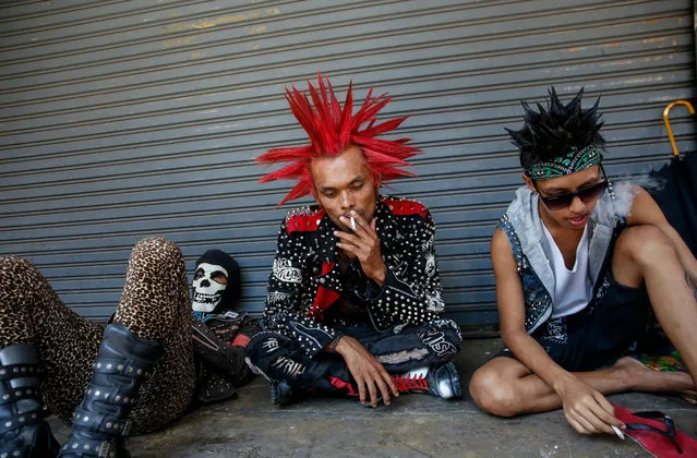 Myanmar punks wearing mohawk hairstyles take part in a punk gathering ahead of the Thingyan water festival in Yangon, Myanmar, 12 April 2018. Myanmar punks have been gathering in Yangon on the day ahead of Thingyan water festival to celebrate every year. The annual water festival is marked with large groups of people congregating to celebrate by splashing water and throwing powder at each others faces as a symbolic sign of cleansing and washing away the sins from the old year to mark the traditional New Year in countries such as Myanmar, Thailand, Laos and Cambodia. This year, the Myanmar Thingyan water festival falls on 13 April and ends on 16 April. (Photo by Lynn Bo Bo/EPA/EFE)