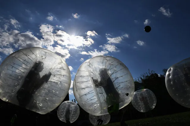 Children play bubble soccer during Aldersgate United Methodist Church's 60th anniversary picnic on Sunday October 23, 2016 in Alexandria, VA. The equipment was provided by BubbleBall MD. (Photo by Matt McClain/ The Washington Post)