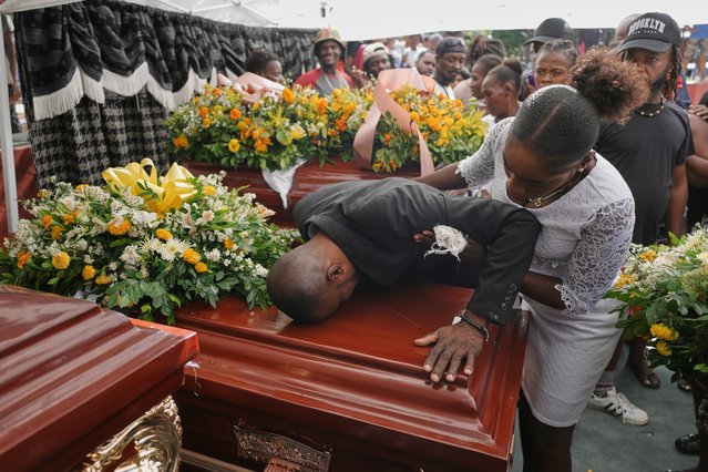 Relatives of Rosiclaire Lenchise mourn during the funeral of victims killed by a landslide triggered by Hurricane Melissa in Petit Goave, Haiti, Saturday, November 15, 2025. (Photo by Odelyn Joseph/AP Photo)
