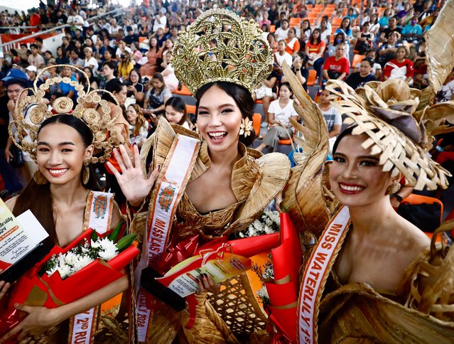 Miss Water Lily 2024 Lois Vivien Garce (C), First runner-up Irish Silades (R) and Second runner-up Micha Selena Rayo (L), wearing gowns made from dried water hyacinth stalks, pose during the Water Lily Festival coronation event in Las Pinas city, Metro Manila, Philippines, 06 August 2024. The annual Water Lily Festival in Las Pinas city was declared by the Villar Foundation to highlight the transformation of water lilies from aquatic nuisances to valuable resources. Through the “Water Lily Weaving Project”, the foundation turns these plants into handicrafts, creating livelihoods and aiding community rehabilitation. During the festival, villagers parade in traditional costumes made from dried water lilies, showcasing the project's success and promoting the benefits of water lily-based livelihoods for local residents. (Photo by Francis R. Malasig/EPA/EFE)