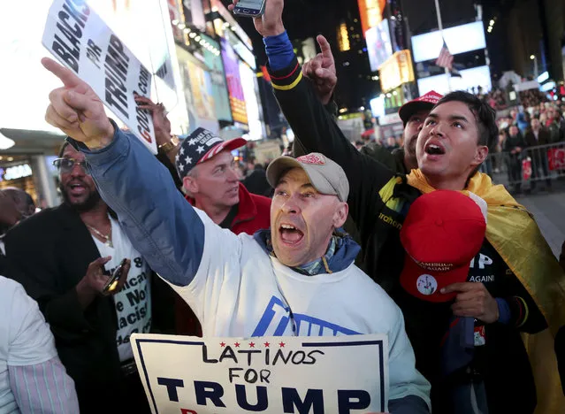 Supporters of Republican presidential candidate Donald Trump react to reports that he had won North Carolina while they were watching results in Times Square, New York, Tuesday, November 8, 2016. (Photo by Seth Wenig/AP Photo)