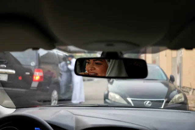 Dr Samira al-Ghamdi, 47, a practicing psychologist, drives around the side roads of a neighborhood as she prepares to hit the road on Sunday as a licensed driver, in Jeddah, Saudi Arabia June 21, 2018. Picture taken June 21, 2018. (Photo by Zohra Bensemra/Reuters)