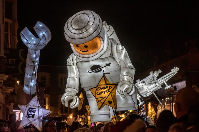 Brighton marks the shortest day of the year on December 21, 2024 with its annual Burning the Clocks parade in UK, which ends with participants throwing the paper and willow lanterns on a bonfire on the beach as a token of the year’s end. (Photo by Andrew Hasson/Alamy Live News)