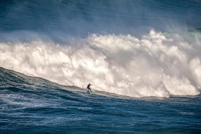 Big wave surfer Nic Von Rupp of Portugal rides a wave during a tow surfing session at Praia do Norte on February 24, 2021 in Nazare, Portugal. (Photo by Octavio Passos/Getty Images)