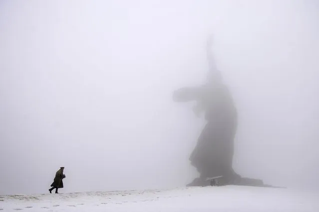 In this Monday, February 2, 2015 file photo, a man dressed in Red Army World War II uniform walks toward the monument to Motherland during ceremonies marking the 72nd anniversary of the Battle of Stalingrad in the southern Russian city of Volgograd, once known as Stalingrad. (Photo by Dmitry Rogulin/AP Photo)