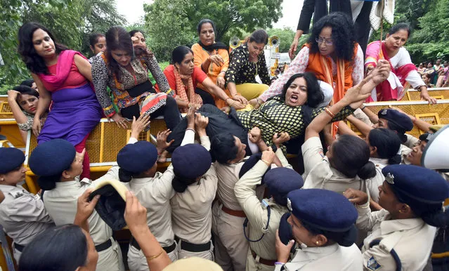 Police personnel detains BJP Mahila Morcha activists while protesting against Aam Aadmi Party at Vidhan Sabha, on August 6, 2018 in New Delhi, India. (Photo by Sushil Kumar/Hindustan Times via Getty Images)