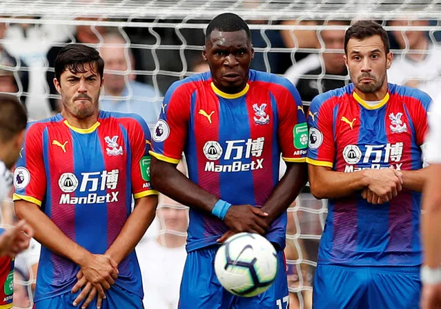 Crystal Palace's James Tomkins, Christian Benteke and Luka Milivojevic during a freekick during the English Premier League football match between Fulham and Crystal Palace at Craven Cottage in London on August 11, 2018. (Photo by John Sibley/Action Images via Reuters)