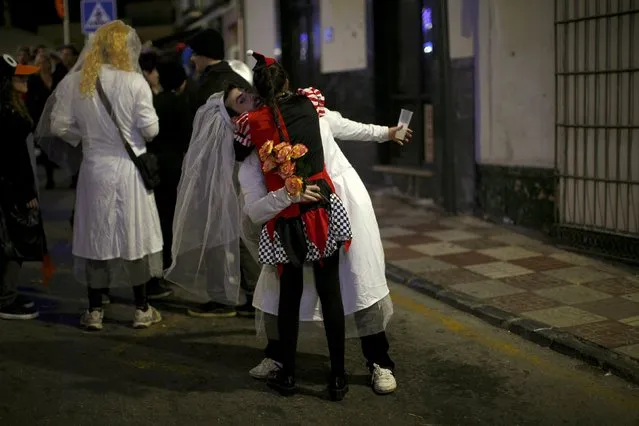 A couple embrace as they take part in New Year celebrations in Coin, near Malaga, southern Spain, January 1, 2016. (Photo by Jon Nazca/Reuters)