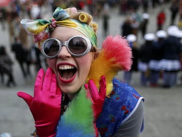 A woman dressed as a cleaning lady laughs during “Weiberfastnacht” (Women's Carnival) in Cologne February 12, 2015. (Photo by Ina Fassbender/Reuters)