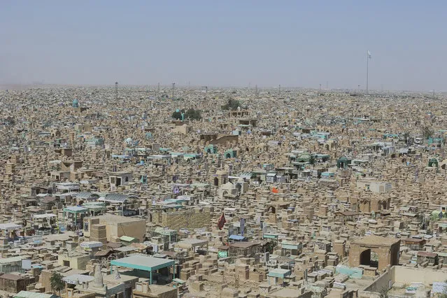 A view of Valley of Peace (Wadi-al-Salaam), hosts 6 million graves in 6 kilometers square, is seen in Najaf, Iraq on March 27, 2021. In the valley, where some tombs are arranged as houses, some look like a cupola and others look like miniature mosques. (Photo by Karar Essa/Anadolu Agency via Getty Images)