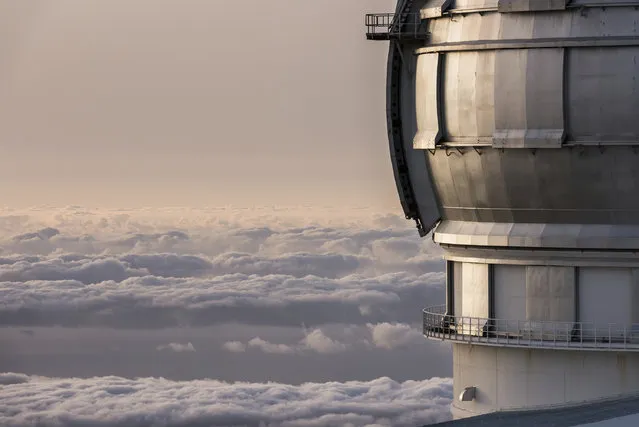 In this image released on Wednesday, July 11, 2018, the Gran Telescopio Canarias, situated above the clouds on a volcanic peak over 2250 metres above sea level at the Roque de los Muchachos Observatory on the island of La Palma in the Canaries, Spain. On July 27th Mars will be nearing the closest it's been to Earth in 15 years. This event, occurring in parallel to the longest lunar eclipse of the 21st century, creates a unique experience offered to six guests on Airbnb to visit the telescope and view the night sky from one of the best stargazing spots on the planet. (Photo by Gemma Miralda/AP Images for Airbnb)
