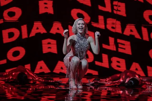 Elena Tsagrinou from Cyprus performs at the first semi-final of the Eurovision Song Contest at Ahoy arena in Rotterdam, Netherlands, Tuesday, May 18, 2021. The powerful Orthodox Church of Cyprus called for the withdrawal of the song in March, saying it mocked the Mediterranean island nation's moral foundations by advocating “our surrender to the devil and promoting his worship”. Tsagrinou played down the controversy. She said “El Diablo”, which she performs flanked by four dancers in skin-tight red costumes, is about an abusive relationship and has nothing to do with devil worship. (Photo by Peter Dejong/AP Photo)