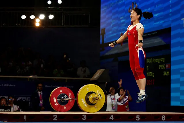 North Korea's Hyongyong Kang reacts after winning the gold medal in the women's 55kg weightlifting competition during the 2022 Asian Games in Hangzhou in China's eastern Zhejiang province on September 30, 2023. (Photo by Ann Wang/Reuters)