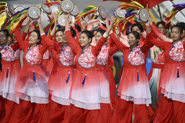 Performers dance as Argentina's President Alberto Fernandez arrives at Beijing's airport ahead of the Belt and Road Forum in the Chinese capital Tuesday, October 17, 2023.(Photo by Jade Gao/Pool Photo via AP Photo)