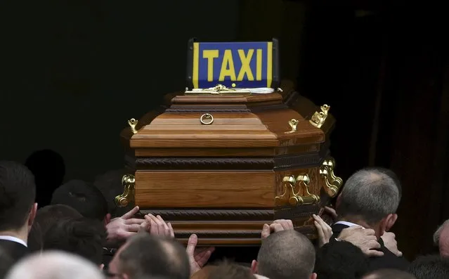 The coffin of Eddie Hutch, a Dublin-based taxi driver, is carried into the church of Our Lady of Lourdes for his funeral service in Dublin, Ireland February 19, 2016. Hutch was shot and killed at his home on Poplar Row on February 8. (Photo by Reuters/Stringer)