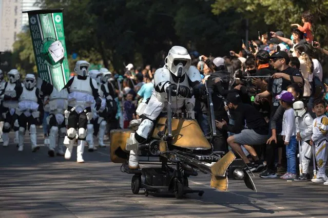 People dressed with Star Wars costumes take part in the 501st Legion Star Wars Parade, at Reforma Avenue, in Mexico City, Mexico on October 15, 2022. (Photo by Daniel Cardenas/Anadolu Agency via Getty Images)