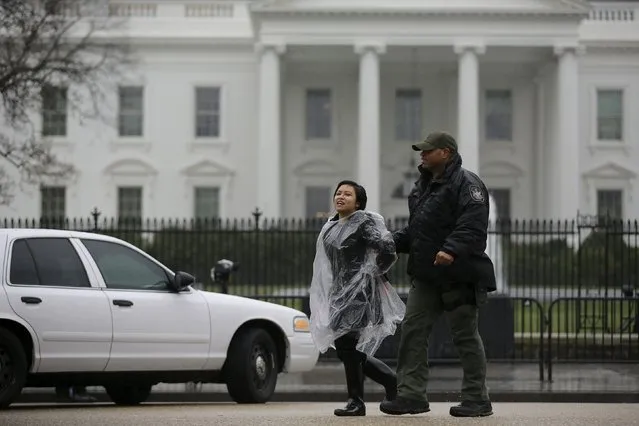 An anti-deportation demonstrator is detained by the police during a protest outside the White House in Washington, February 23, 2016. (Photo by Carlos Barria/Reuters)