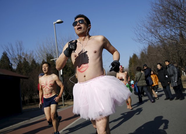 Participants run at the “Half-Naked Marathon” at Olympic Forest park in Beijing, China, February 28, 2016. This annual running event which requires participants to run half-naked, was organized to promote environmentally friendly lifestyles. (Photo by Kim Kyung-Hoon/Reuters)