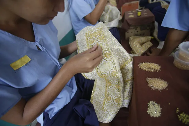 In this January 6, 2017 photo, transgender inmates learn embroidery at Pattaya Remand Prison in Pattaya, Chonburi province, Thailand. The prison separates lesbian, gay, bisexual and transgender prisoners from other inmates, a little-known policy despite being in place nationwide since 1993, according to the Department of Corrections. (Photo by Sakchai Lalit/AP Photo)