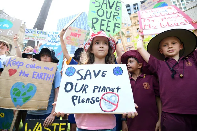 School students take part in the global #ClimateStrike rally in Brisbane, Australia, March 15, 2019. (Photo by Dan Peled/AAP Image via Reuters)