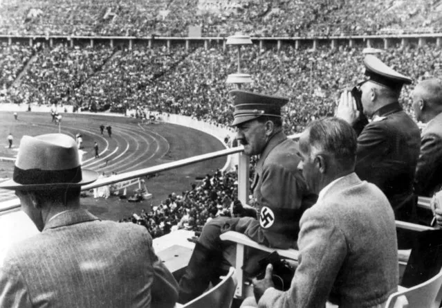 From left to right, Dr. Joseph Goebbels, German Chancellor Adolf Hitler, Reichs Sports Leader Hans von Tschammer und Osten and General Field Marschall Werner von Blomberg observe the Olympic Games in Berlin, Germany in August 1936. The International Olympic Committee has always been political, from the sheikhs and royals in its membership to a seat at the United Nations to pushing for peace talks between the Koreas. But Russia’s invasion of Ukraine three weeks ago exposed its irreconcilable claims of “political neutrality”. (Photo by AP Photo, File)