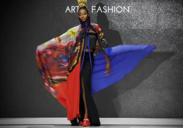 A model presents a creation by Loayo Art and Creations by Moroccan artist Loubna Ayouche during the African Fashion International (AFI) Cape Town Fashion Week, in Cape Town, South Africa, 13 April 2019. (Photo by Nic Bothma/EPA/EFE)