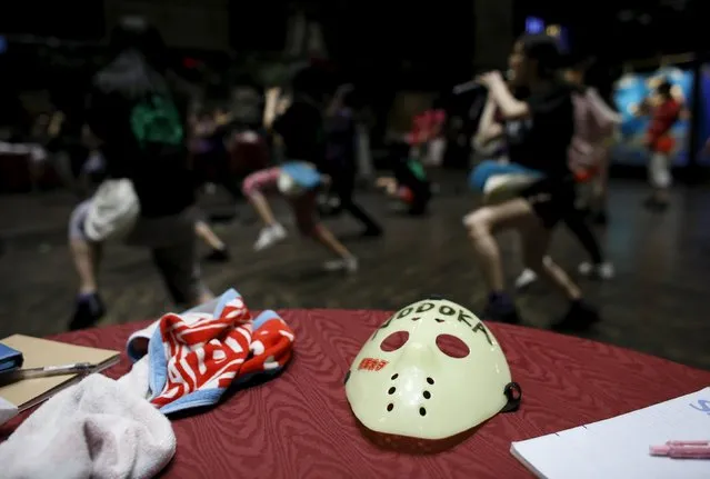 Members of Japanese idol group Kamen Joshi (Masked Girls) perform during a rehearsal ahead of a concert at their theatre in Tokyo's Akihabara district, Japan March 17, 2016. (Photo by Toru Hanai/Reuters)