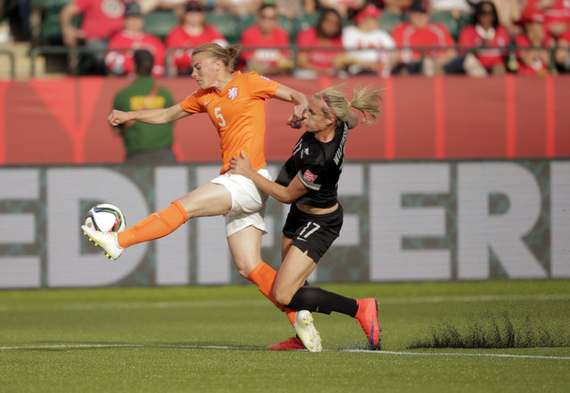 New Zealand forward Hannah Wilkinson (17) and Netherlands defender Petra Hogewoning (5) go after the ball in Edmonton, June 6, 2015. (Photo by Erich Schlegel/USA TODAY Sports)