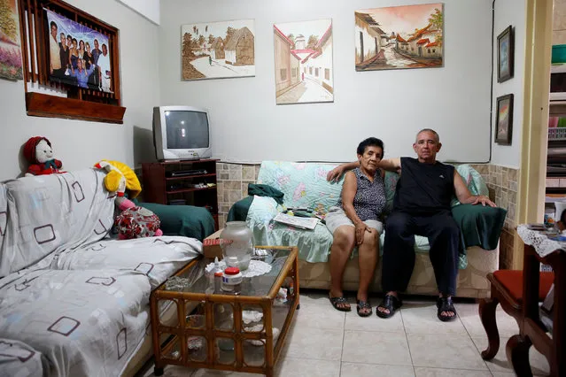 Antonio Marquez (L) and his wife Maria de Marquez, pose for a picture at their home in Caracas, Venezuela April 23, 2016. “We are eating less, because we have been limiting ourselves. We used to keep the refrigerator full, but now is no longer so”, said Marquez. (Photo by Carlos Garcia Rawlins/Reuters)