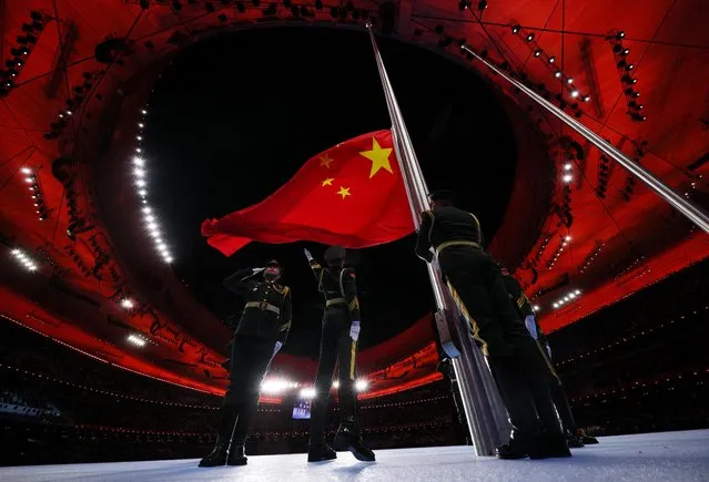 The Chinese flag is raised during the opening ceremony of the Beijing 2022 Winter Olympic Games, at the National Stadium, known as the Bird's Nest, in Beijing, on February 4, 2022. (Photo by Brian Snyder/Reuters)
