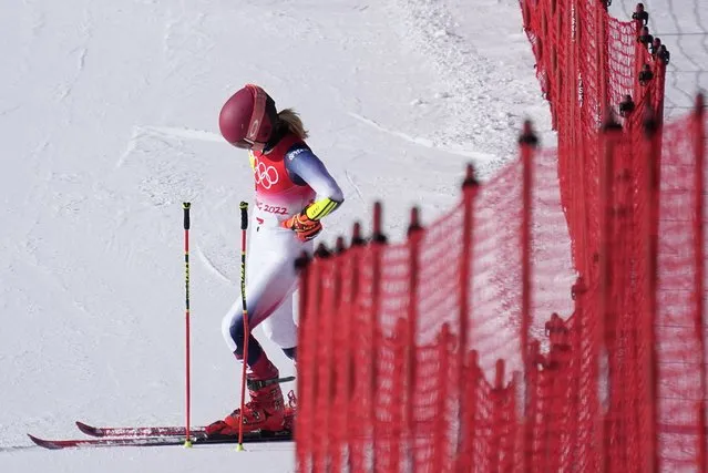 Mikaela Shiffrin of United States looks down after skiing off course during the first run of the women's giant slalom at the 2022 Winter Olympics, Monday, February 7, 2022, in the Yanqing district of Beijing. (Photo by Robert F. Bukaty/AP Photo)