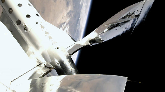 In this photo provided by Virgin Galactic, the VSS Unity reaches a speed of Mach 3, and a space altitude of 53.5 miles above the Earth on Sunday, July 11, 2021. Entrepreneur Richard Branson and five crewmates from his Virgin Galactic space-tourism company reached an altitude of about 53 miles (88 kilometers) over the New Mexico desert, enough to experience three to four minutes of weightlessness and see the curvature of the Earth. (Photo by Virgin Galactic via AP Photo)