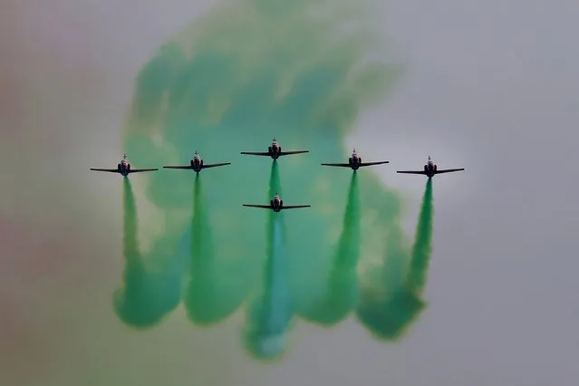 Pakistan Air Force jets demonstrate an aerobatic performance during a military parade to mark Pakistan National Day in Islamabad, Pakistan, Wednesday, March 23, 2022. Pakistanis celebrated on Wednesday their National Day with a military parade in the capital, Islamabad, showcasing this Islamic nation's elite army units and high-tech weaponry, including short, medium, and long-range missiles, tanks, fighter jets and other hardware. (Photo by Anjum Naveed/AP Photo)