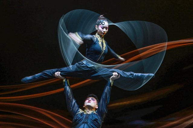 The photo taken on September 5, 2024 shows acrobats performing during a show at a theater in Shenyang, in northeastern China's Liaoning province. (Photo by AFP Photo/China Stringer Network)