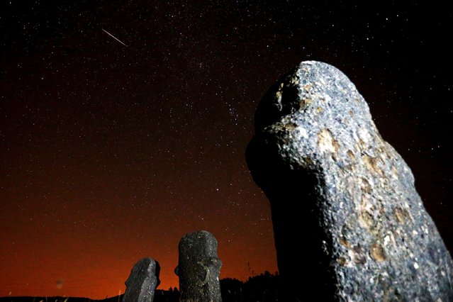 A meteor streaks across the sky during the Perseid meteor shower at the Maculje archaeological site near Novi Travnik in the early morning August 13, 2015. The annual Perseid meteor shower reaches its peak on August 12 and 13 in Europe, according to NASA. (Photo by Dado Ruvic/Reuters)