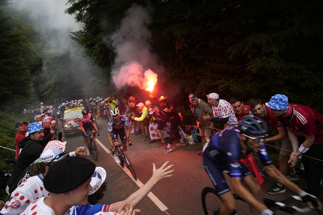 France's David Gaudu is followed by France's Julian Alaphilippe, center, and Latvia's Krists Neilands, left, during the fifth stage of the Tour de France cycling race over 163 kilometers (101 miles) with start in Pau and finish in Laruns, France, Wednesday, July 5, 2023. (Photo by Daniel Cole/AP Photo)