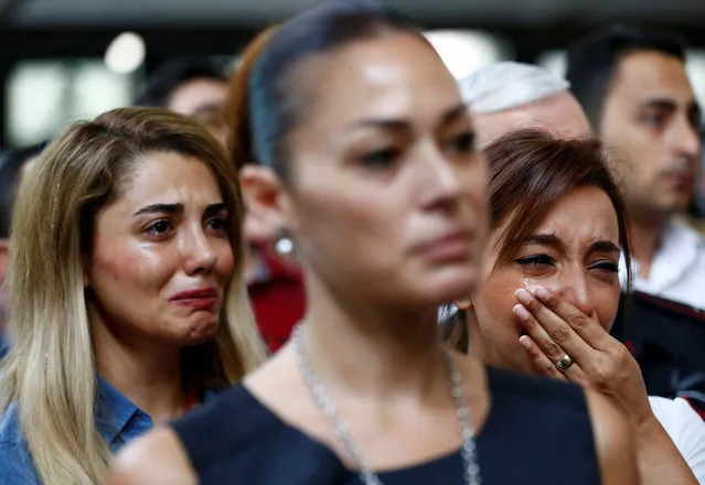 Airport employees mourn for their friends, who were killed in Tuesday's attack at the airport, during a ceremony at the international departure terminal of Ataturk airport in Istanbul, Turkey, June 30, 2016. (Photo by Murad Sezer/Reuters)