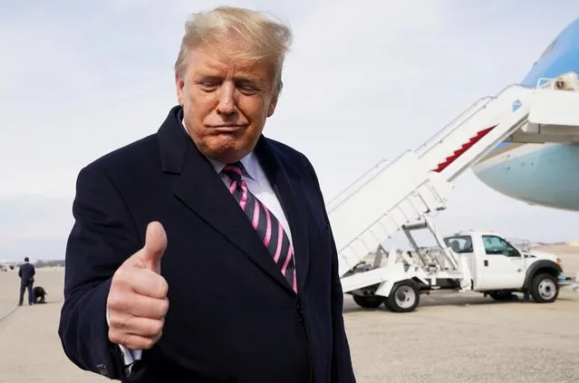 U.S. President Donald Trump gestures to reporters as he departs Washington for campaign travel to California from Joint Base Andrews in Maryland, U.S., February 18, 2020. (Photo by Kevin Lamarque/Reuters)