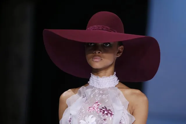 A model presents a creation by Australian designers Tamara Ralph and Michael Russo as part of their Haute Couture Fall/Winter 2016/2017 collection for British fashion house Ralph & Russo in Paris, France, July 4, 2016. (Photo by Gonzalo Fuentes/Reuters)