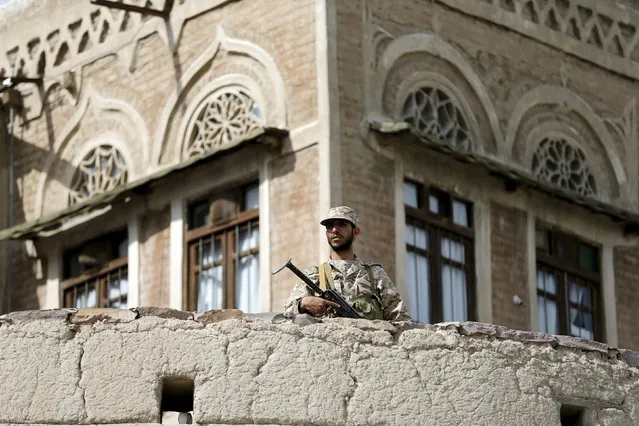 A Houthi militant secures an area where fellow Houthis demonstrated against the Saudi-led air strikes in Yemen's capital Sanaa August 24, 2015. (Photo by Khaled Abdullah/Reuters)