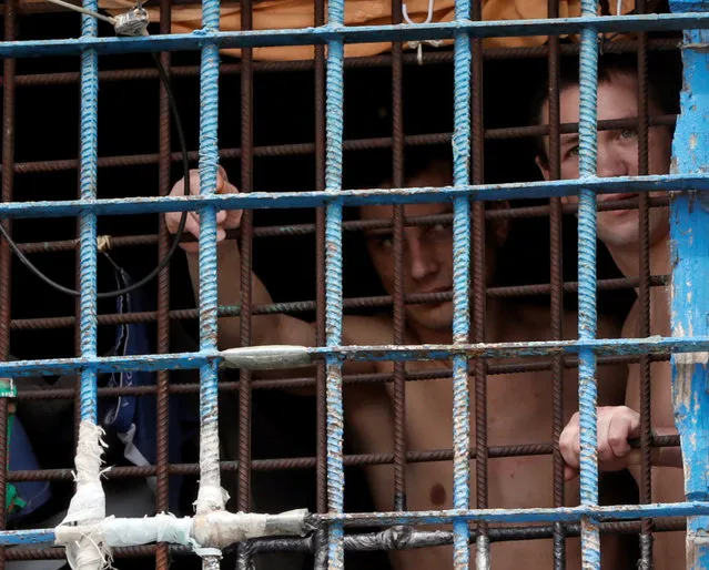 Detainees look out from a prison cell at a compound of the Lukyanivska detention centre in Kiev, Ukraine, July 19, 2016. (Photo by Valentyn Ogirenko/Reuters)