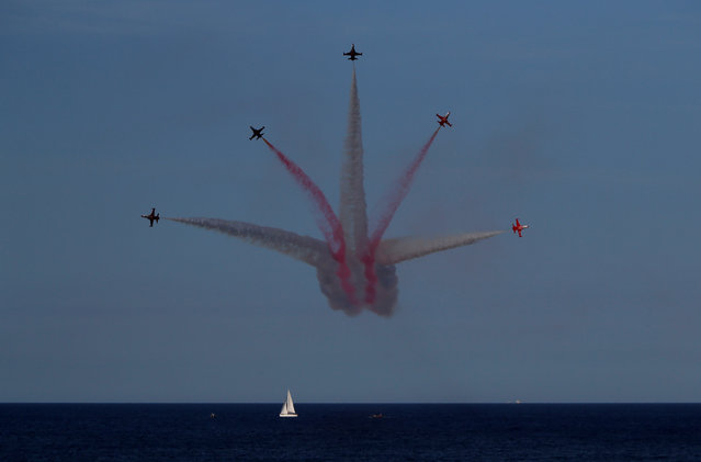 The Turkish Stars aerobatic team of the Turkish Air Force fly their NF-5A Freedom Fighters over a yacht during the Malta International Airshow at SmartCity Malta outside Kalkara, Malta, September 24, 2017. (Photo by Darrin Zammit Lupi/Reuters)