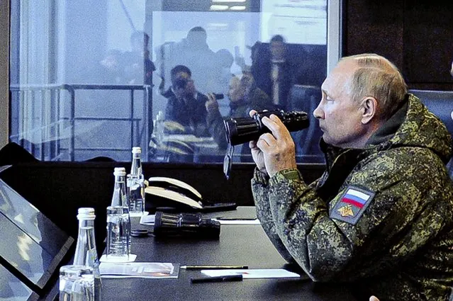 Russian President Vladimir Putin watches the Vostok 2022 (East 2022) military exercise in far eastern Russia, outside Vladivostok, on Tuesday, September 6, 2022. The weeklong exercise that began Thursday is intended to showcase growing defense ties between Russia and China and also demonstrate that Moscow has enough troops and equipment to conduct the massive drills even as its troops are engaged in military action in Ukraine. (Photo by Mikhail Klimentyev, Sputnik, Kremlin Pool Photo via AP Photo)