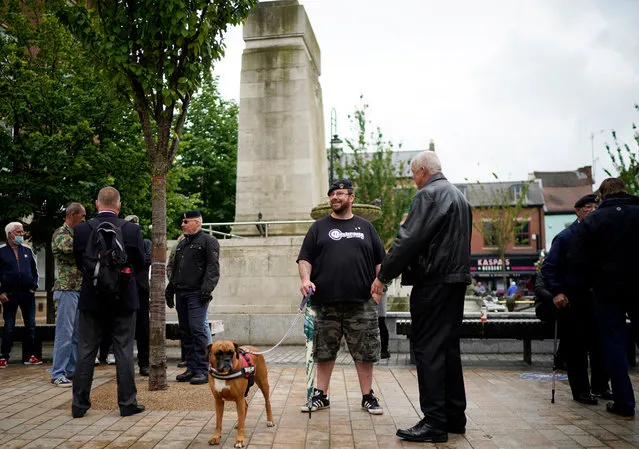 A group of patriots gather to guard the cenotaph ahead of the Black Lives Matter protest on June 10, 2020 in Hull, United Kingdom. The death of an African American man, George Floyd, while in the custody of Minneapolis police has sparked protests across the United States, as well as demonstrations of solidarity in many countries around the world. At the weekend, anti-racism protests across the UK resulted in some statues being vandalised. (Photo by Christopher Furlong/Getty Images)