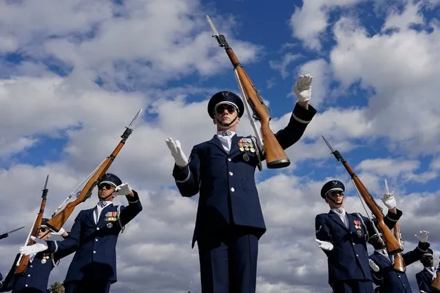 Members of the U.S. Air Force Honor Guard Drill Team, lead Master Sgt. Antonio Lofton, perform during the Joint Service Drill-Off at the Lincoln Memorial in Washington, Wednesday, October 19, 2022. Each team received a uniform inspection, performed a full drill, and a solo drill. Guest judges, members of the United States Capitol Police Honor Guard, selected the Marine Corps Silent Drill Platoon lead by Staff Sgt. Henry Trazy III as the winner. (Photo by Carolyn Kaster/AP Photo)