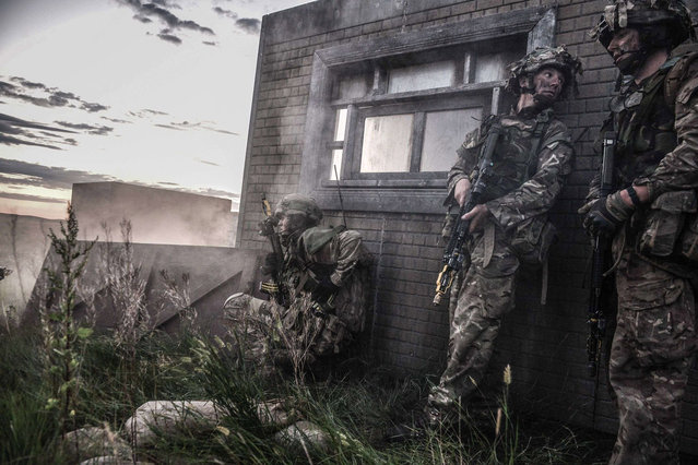1st Battalion Scots Guards (1 SG) and the 1st Battalion The Royal Welsh (1 R WELSH) attacking the village of Hettar during Ex Prairie Tempest by Sergeant Mark. Webster which won the Professional Soldiering Image category; Army Photographic Competition, Britain, October 8, 2014. (Photo by MoD/Geoff Robinson Photography/REX Features)