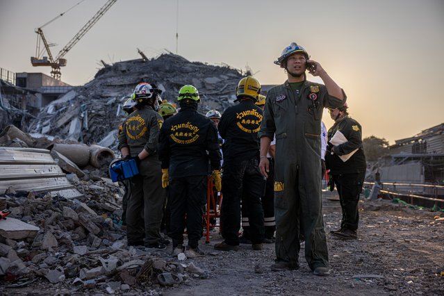 Thai rescue teams provide aid at a construction building collapse in Bangkok's Chatuchak area on March 28, 2025 in Bangkok, Thailand. A powerful 7.7 magnitude earthquake struck Myanmar on March 28, 2025, causing strong tremors that were felt in Bangkok, where buildings swayed and hundreds of people evacuated onto the streets. (Photo by Lauren DeCicca/Getty Images)