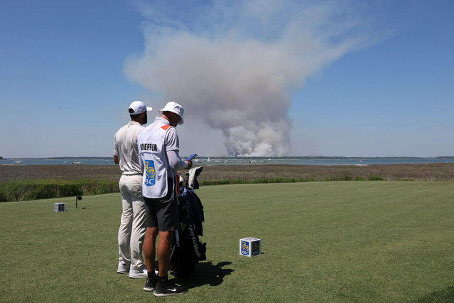 Scottie Scheffler of the United States prepares for a shot with his caddie, Ted Scott, on the 18th tee during the first round of the RBC Heritage 2025 at Harbour Town Golf Links on April 17, 2025 in Hilton Head Island, South Carolina. (Photo by Andrew Redington/Getty Images)