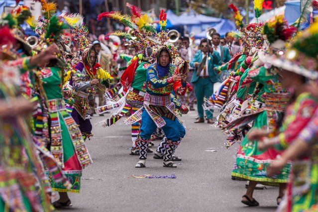 Artists dance during the folklore parade called Jisk'a Anata, in La Paz, Bolivia, 12 February 2024. The joyful rhythms of carnivals in different regions of Bolivia, especially those in the Andean zone, were showcased on 12 February in the Jisk'a Anata, a folklore parade that toured the main streets of La Paz with messages of diversity and inclusion, have several people with disabilities among the dancers. (Photo by Esteban Biba/EPA)